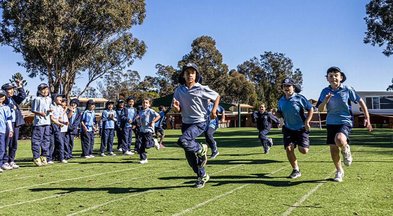 Students racing against each other at St John Vianney's Primary School Doonside
