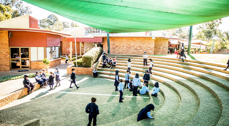 Students playing in the school amphitheatre at St John Vianney's Primary School Doonside