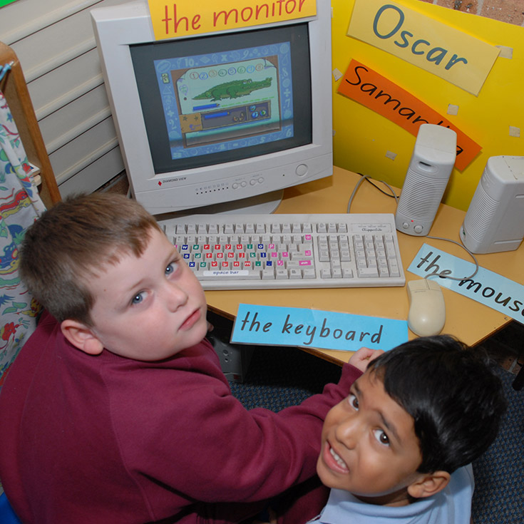 Former students being taught about new technology at St John Vianney's Primary School Doonside
